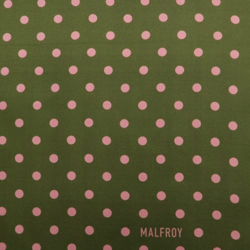 Muster Polkadots in rosa auf grünem Seidentuch